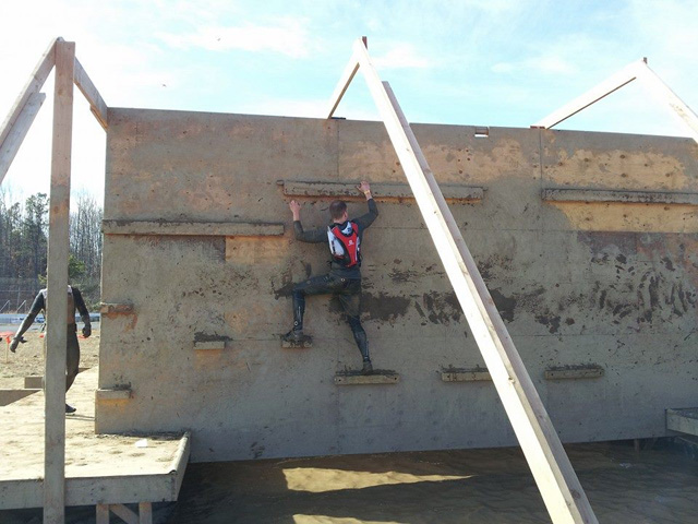 Matt climbing a wall